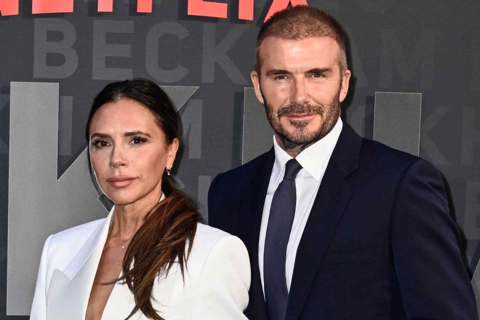 <p>Gareth Cattermole/Getty</p> Victoria and David Beckham