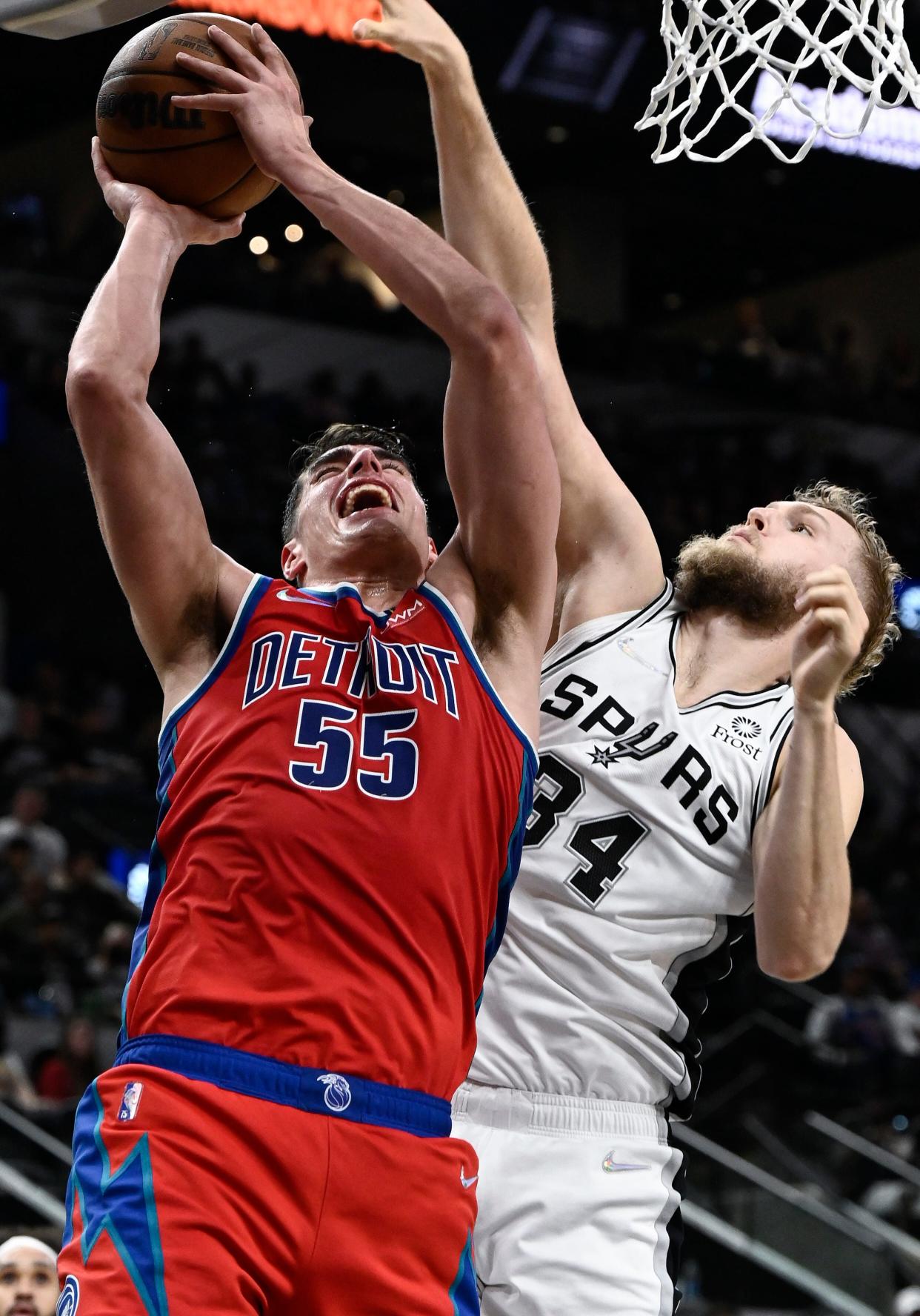 Pistons center Luka Garza attempts to shoot against Spurs center Jock Landale during the first half on Sunday, Dec. 26, 2021, in San Antonio.