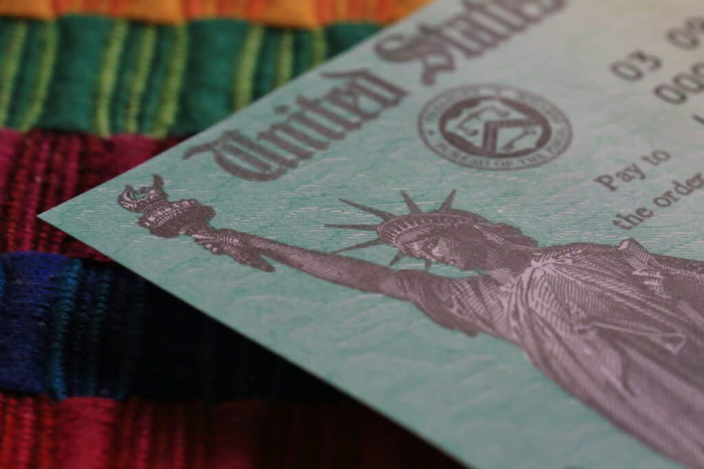 A closeup of a federal government check, focusing on an image of the Statue of Liberty.