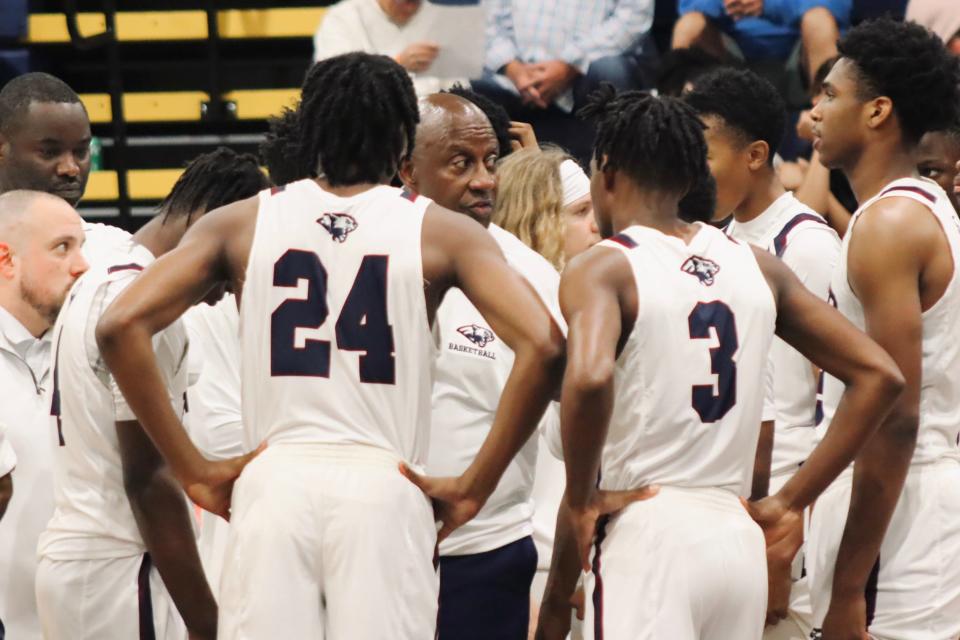 Four-time state champion coach Fred Ross talks with Panthers players before facing rival Wellington. To stand 12-1 on the season, Dwyer went on to win, 67-59, the Panthers' 67-59 win over Wellington in Palm Beach Gardens on Jan. 9, 2024.