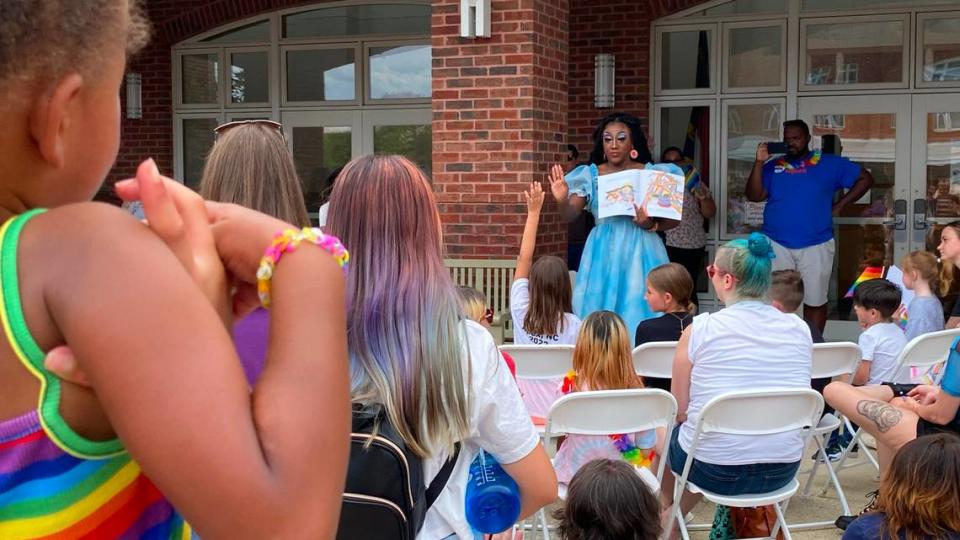 Drag queen “Stormie Daye” reads to children and parents at the Apex Pride Festival during Drag Queen Story Hour, Saturday, June 11, 2022.