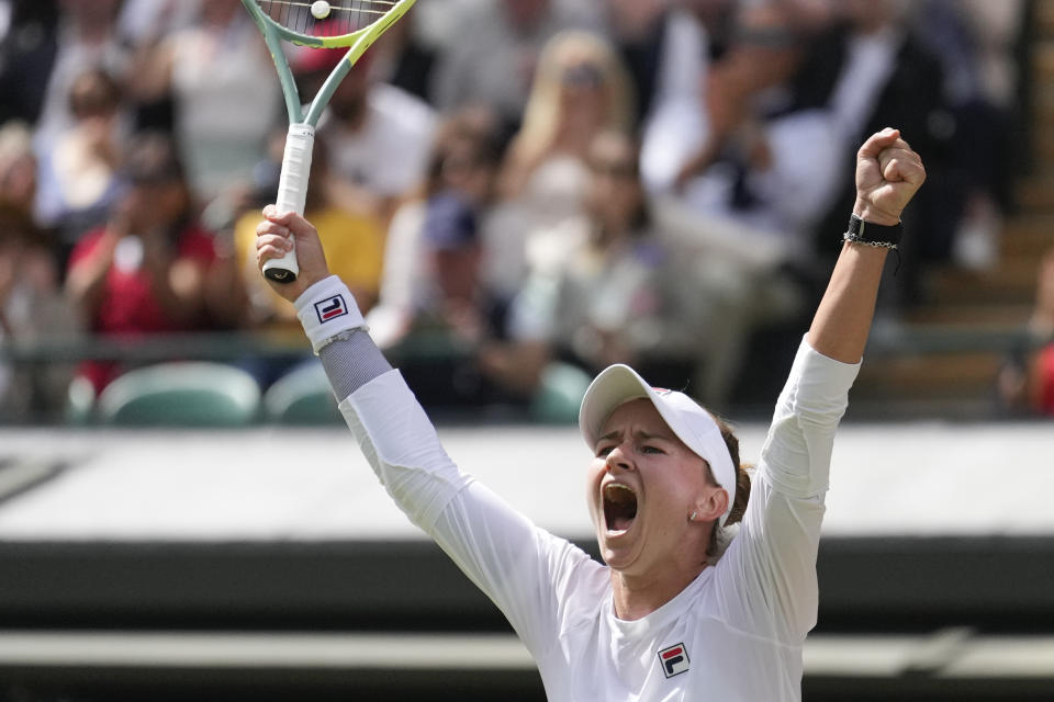 Barbora Krejcikova of the Czech Republic celebrates after defeating Jelena Ostapenko of Latvia in their quarterfinal match at the Wimbledon tennis championships in London, Wednesday, July 10, 2024. (AP Photo/Mosa'ab Elshamy)