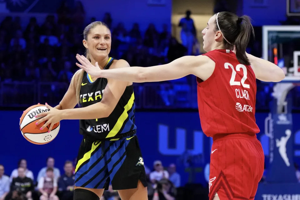 ARLINGTON, TEXAS - SEPTEMBER 01: Jacy Sheldon #4 of the Dallas Wings is defended by Caitlin Clark #22 of the Indiana Fever during the first half at College Park Center on September 01, 2024 in Arlington, Texas. NOTE TO USER: User expressly acknowledges and agrees that, by downloading and or using this photograph, User is consenting to the terms and conditions of the Getty Images License Agreement. (Photo by Sam Hodde/Getty Images)