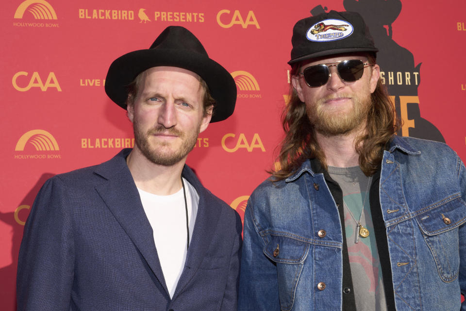 Jeremiah Fraites, left, and Wesley Schultz of The Lumineers arrive at Willie Nelson 90, celebrating the singer's 90th birthday on Saturday, April 29, 2023, at the Hollywood Bowl in Los Angeles. (Photo by Allison Dinner/Invision/AP)