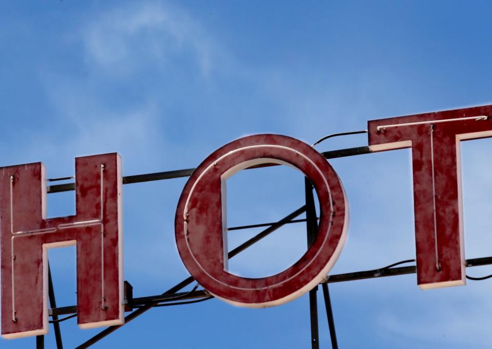 A sign atop the De Anza Hotel describes a typical day in the border town of Calexico