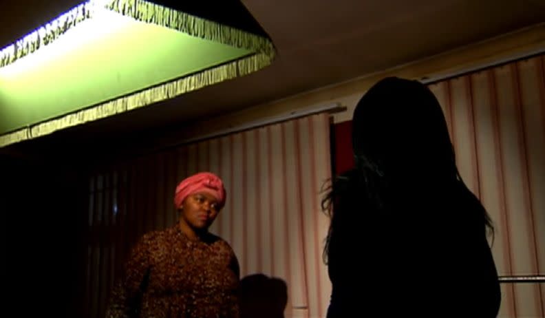 The mother, whose silhouette can be seen in this image from a SABC News interview, has chosen to remain anonymous to protect her son's privacy. (Photo: SABC News)