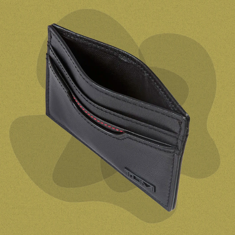 <p>Courtesy of Nordstrom</p><p>Tumi’s take on a card case wallet has three card pockets, a center currency pocket, and a transparent ID slot—just the basics. The two dozen or so red stitches on the bottom card pocket and embossed logo are the only clue that this otherwise plain wallet is a Tumi, but on the inside, the company’s commitment to stellar travel gear is fully realized. The Delta ID lock technology incorporated into this slim wallet keeps cards safe from scammers with scanners, allowing peace of mind when traveling, even if it’s just a trip to the post office a few blocks away.</p><p>[$95; <a href="https://click.linksynergy.com/deeplink?id=b8woVWHCa*0&mid=1237&u1=mj-bestslimwallets-cleblanc-081023-update&murl=https%3A%2F%2Fwww.nordstrom.com%2Fs%2Ftumi-delta-id-lock-shielded-slim-card-case-id-wallet%2F3764142" rel="nofollow noopener" target="_blank" data-ylk="slk:nordstrom.com;elm:context_link;itc:0;sec:content-canvas" class="link ">nordstrom.com</a>]</p>