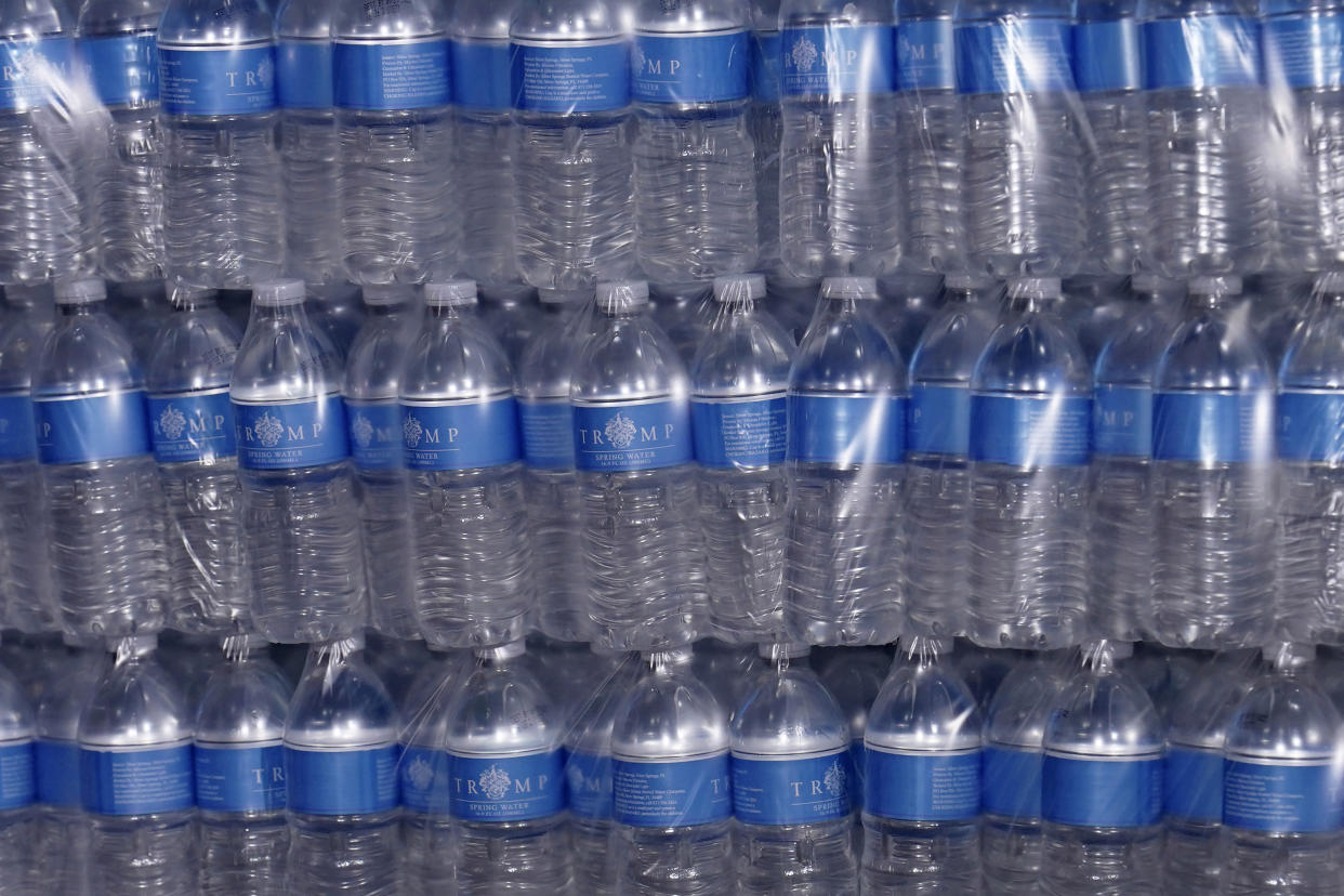 An array of plastic bottles of water.