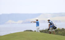 Northern Ireland's Rory McIlroy gestures as he looks down the 5th hole during a practice round ahead of the start of the British Open golf championships at Royal Portrush in Northern Ireland, Tuesday, July 16, 2019. The British Open starts Thursday. (AP Photo/Peter Morrison)