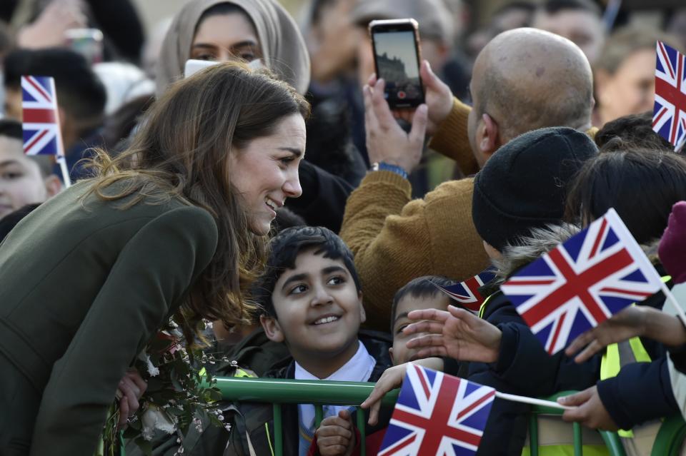 Britain's Kate Duchess of Cambridge speaks with a pupil as she meets the members of the public at Centenary Square in Bradford northern England, Wednesday, Jan. 15, 2020. (AP Photo/Rui Vieira)