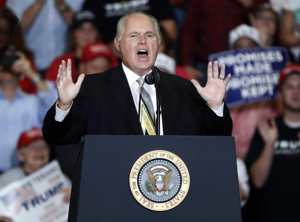 FILE - This Nov. 5, 2018 file photo shows radio personality Rush Limbaugh introducing President Donald Trump at the start of a campaign rally in Cape Girardeau, Mo. Limbaugh says he’s been diagnosed with advanced lung cancer. Addressing listeners on his program Monday, Feb. 3, 2020, he said he will take some days off for further medical tests and to determine treatment. (AP Photo/Jeff Roberson, File)