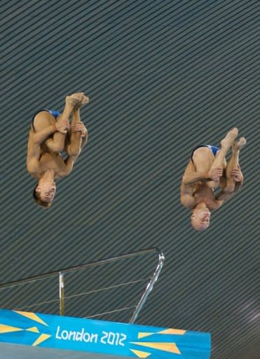 Britain's Tom Daley (left) and Peter Waterfield jump from the 10m board during a practice session ahead of the London 2012 Olympic Games at the Aquatics Centre in the Olympic Park in east London on July 16. Daley has been targeted by abusive Twitter messages after one of the Olympic hosts' poster boys missed out on a medal in his opening event at the London Games