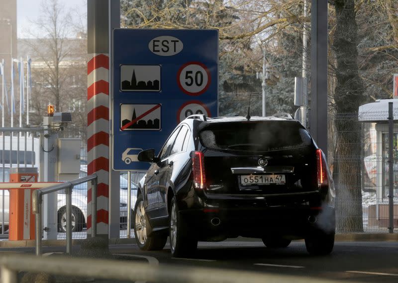 FILE PHOTO: A car leaves the border crossing point with Russia in Narva