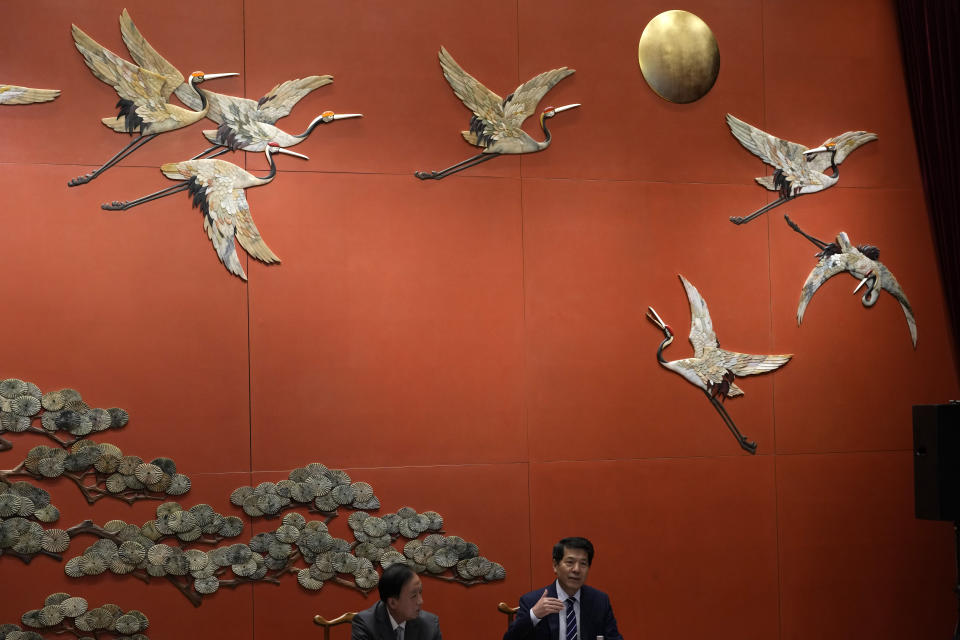 China's Ukraine envoy Li Hui at right speaks to media in Beijing, Friday, June 2, 2023. Li appealed Friday to other governments to "stop sending weapons to the battlefield" and hold peace talks but gave no indication that his trip to the region made any progress toward a settlement. (AP Photo/Ng Han Guan)