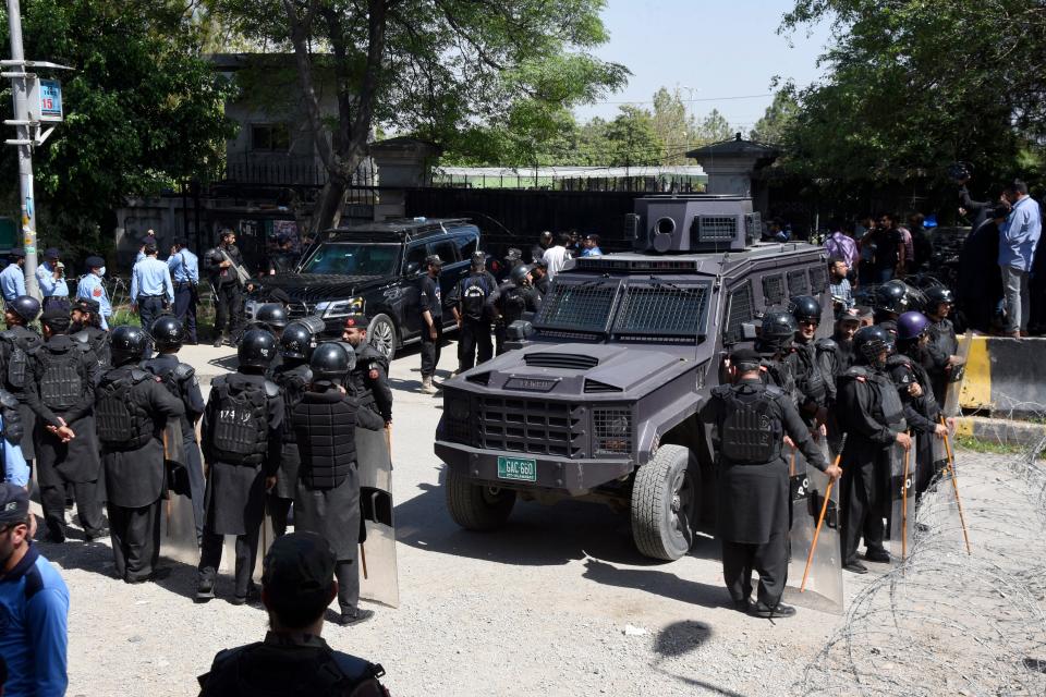 Pakistan's riot police officers stand guard with an armored vehicle outside a court, where Pakistan's former Prime Minister Imran Khan appearing, in Islamabad, Pakistan, Tuesday, May 9, 2023. Officials from the party of Pakistan's former Prime Minister Khan say he has been arrested as he appeared in a court in the capital, Islamabad, to face charges in multiple graft cases.