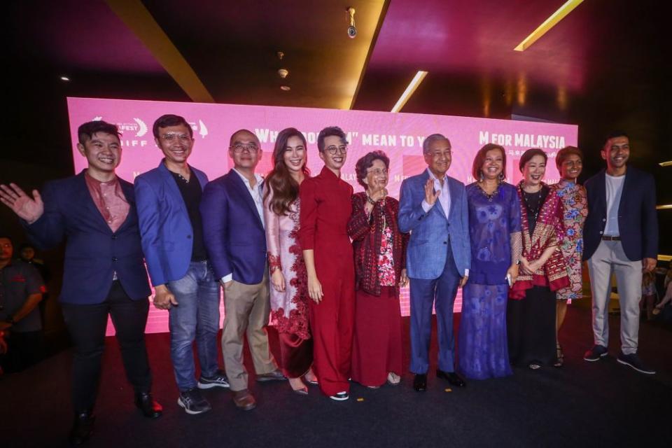 Prime Minister Tun Dr Mahathir Mohamad and Tun Dr Siti Hasmah Mohd Ali pose for a group picture with the production team of ‘M for Malaysia’ during its premiere at GSC Pavilion, Kuala Lumpur September 10, 2019. — Picture by Hari Anggara