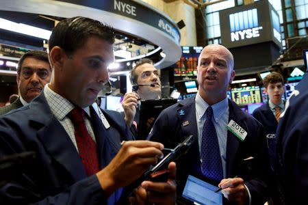 Traders work on the floor of the New York Stock Exchange (NYSE) in New York City, U.S., July 26, 2016. REUTERS/Brendan McDermid