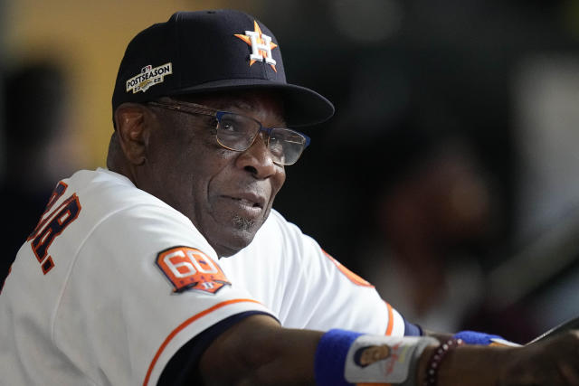 Houston Astros manager Dusty Baker Jr., right, presents New York