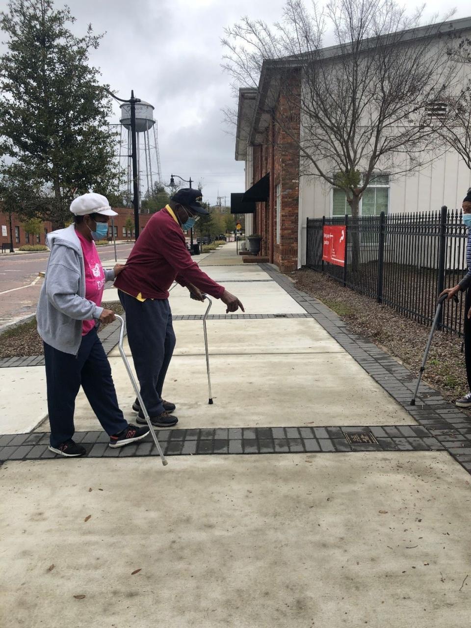 James and Pansy Wyche Sr. seeing the plaque commemorating their business, the Busy Bee Café, on the 300 block of West Jackson Street in Thomasville, Georgia, for the first time.