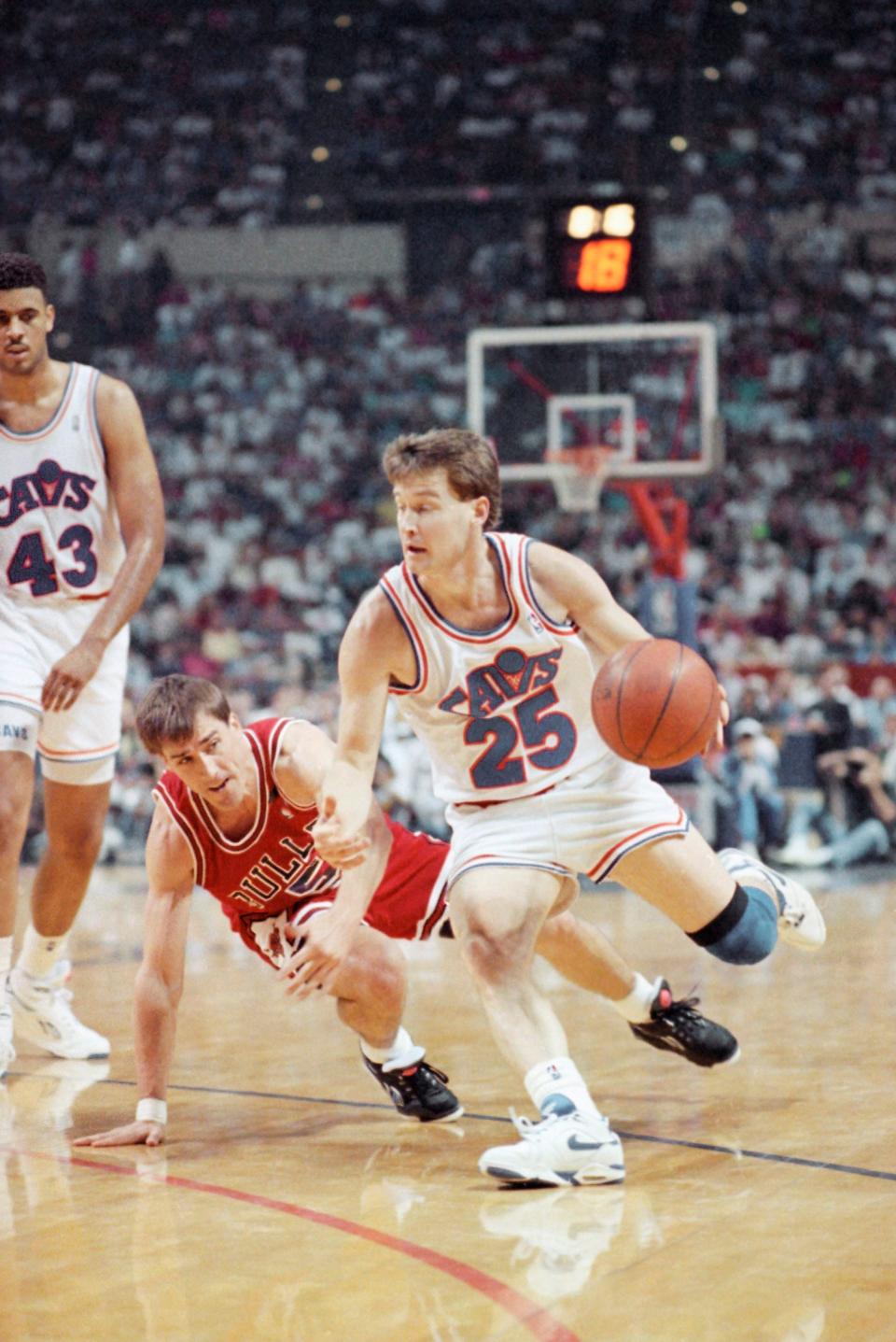 Cavaliers guard Mark Price drives around John Paxson of the Chicago Bulls in Game 4 of the NBA Eastern Conference finals, May 26, 1992, at Richfield Coliseum.
