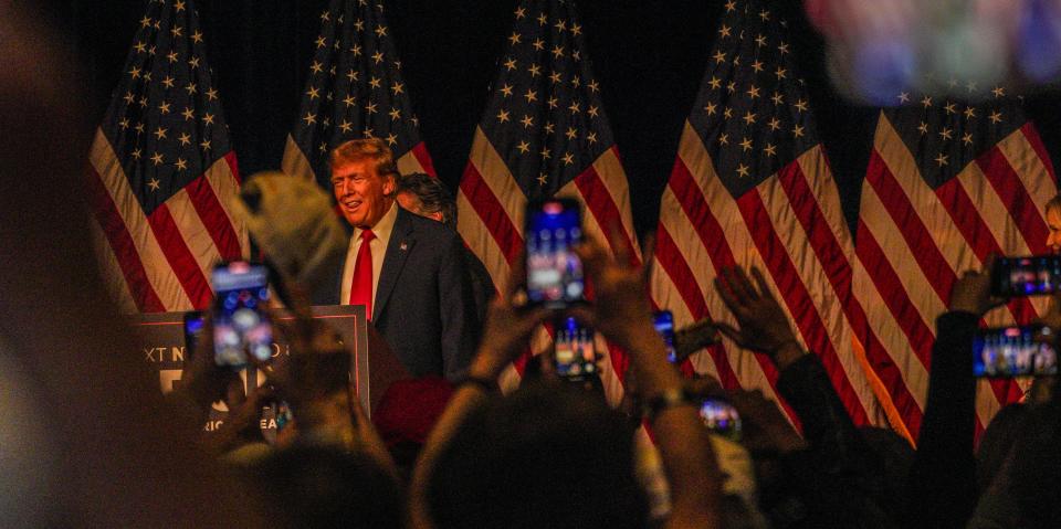 Former President Donald Trump listens to cheers as he celebrates his victory in the Feb. 8, 2024, Nevada caucus, at the Treasure Island casino hotel in Las Vegas.