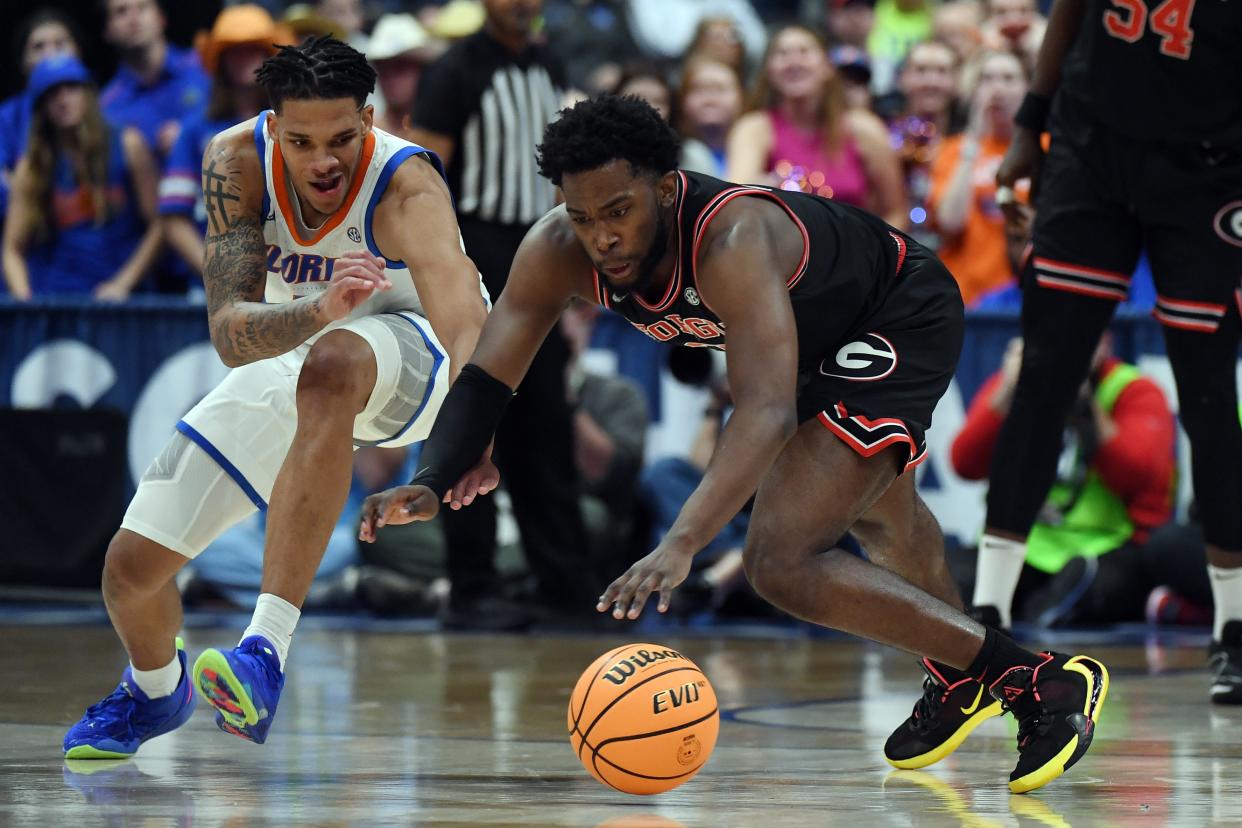 Mar 14, 2024; Nashville, TN, USA; Georgia Bulldogs guard Noah Thomasson (3) and Florida Gators guard Will Richard (5) dive for a loose ball during the first half at Bridgestone Arena. Mandatory Credit: Christopher Hanewinckel-USA TODAY Sports