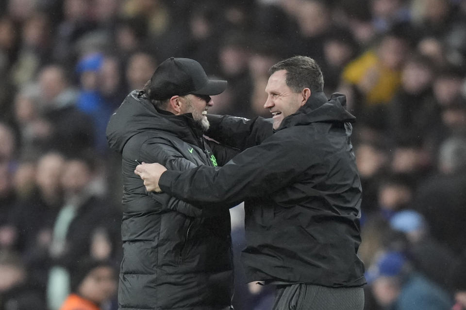 Liverpool's manager Jurgen Klopp, left, celebrates after Liverpool's Virgil van Dijk scored in extra time during the English League Cup final soccer match between Chelsea and Liverpool at Wembley Stadium in London, Sunday, Feb. 25, 2024. (AP Photo/Alastair Grant)