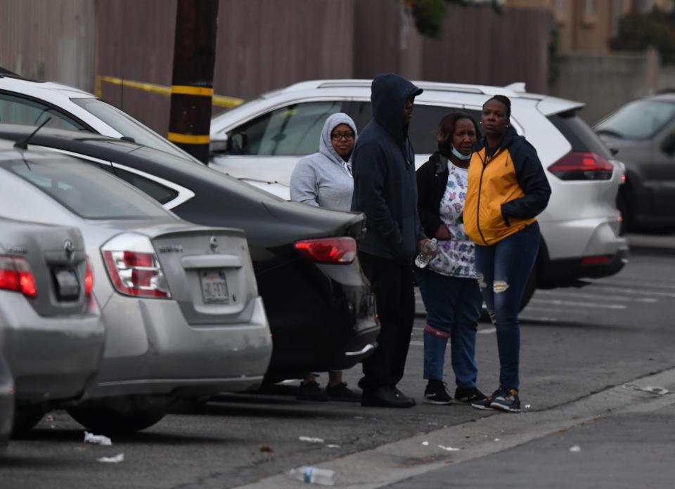 People wait for news outside the Gable House Bowl center after three men were killed and four injured in a shooting at the bowling alley in Torrance, California, according to police, on Jan. 5, 2019. (Photo: Mark Ralston/AFP/Getty Images)