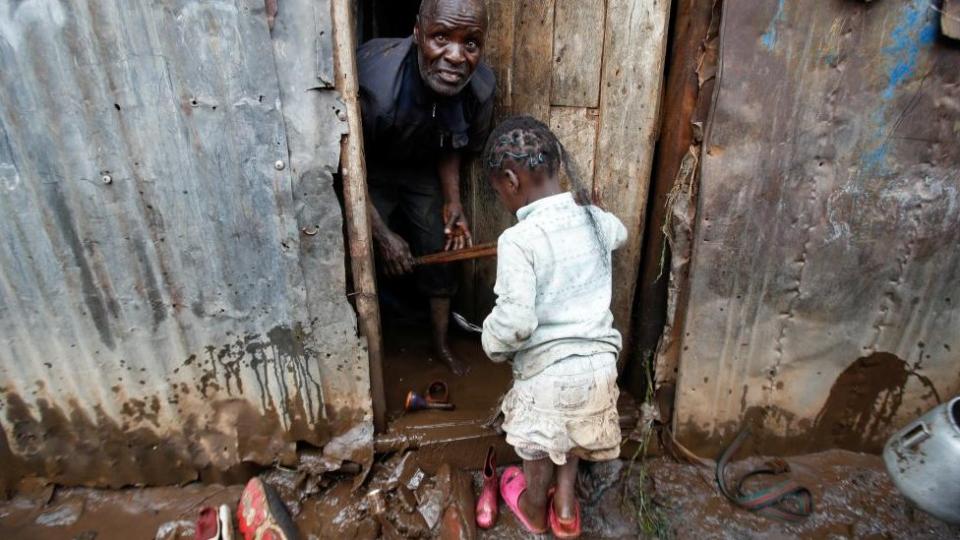 A resident tries to clean his house stranded in floodwaters after the Nairobi River burst its banks in the Mathare Valley settlement in Nairobi, Kenya, April 24, 2024