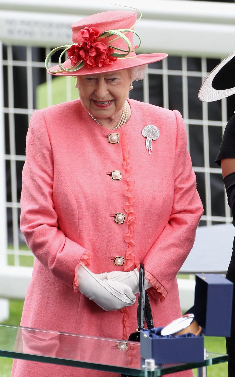 Queen Elizabeth II prepares to present the Gold Cup in the Parade Ring on Ladies Day at Royal Ascot