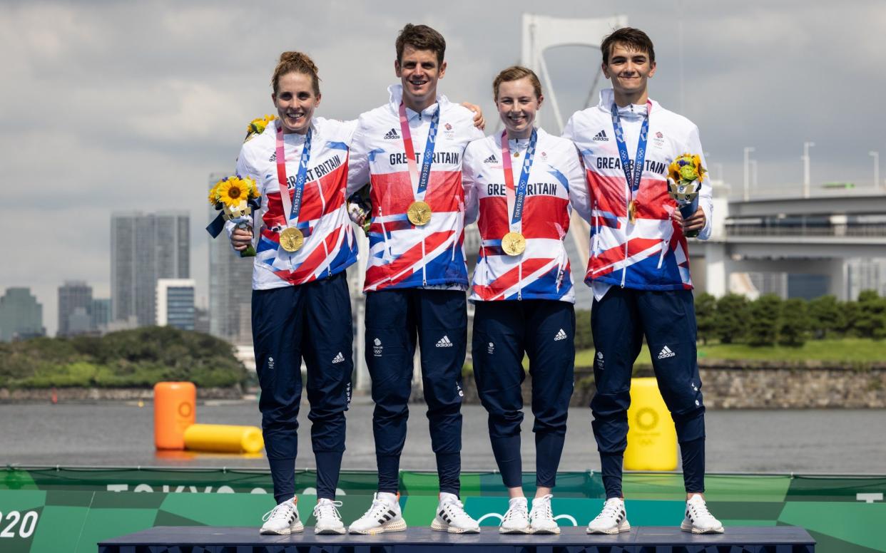 Jessica Learmonth, Jonny Brownlee, Georgia Taylor-Brown and Alex Yee of Team Great Britain celebrate on the podium during the medal ceremony following the Mixed Relay Triathlon on day eight of the Tokyo 2020 Olympic Games at Odaiba Marine Park on July 31, 2021 in Tokyo, Japan. - GETTY IMAGES