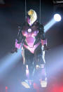 Rebel Wilson makes a dramatic entrance what she calls her 'Iron Man-gina' suit.