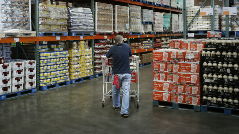 Costco shopper pushing cart