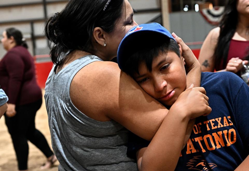 Adrian Alonzo is consoled by his mother