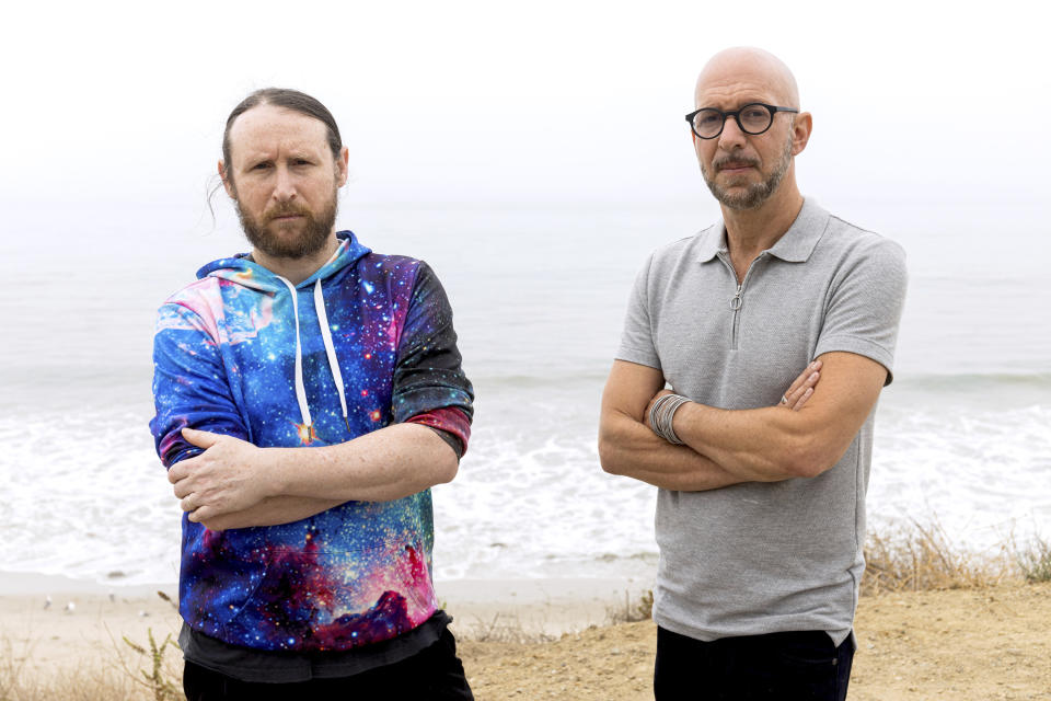 Author Neil Strauss, right, and Incubus guitarist Mike Einziger, of the podcast "To Live and Die in LA," pose for a portrait on Thursday, June 17, 2021, in Malibu, Calif. Strauss is back with a second season of his podcast, focusing on the 2017 disappearance of Elaine Park, a 20-year-old woman last seen in Calabasas, California. (Photo by Willy Sanjuan/Invision/AP)