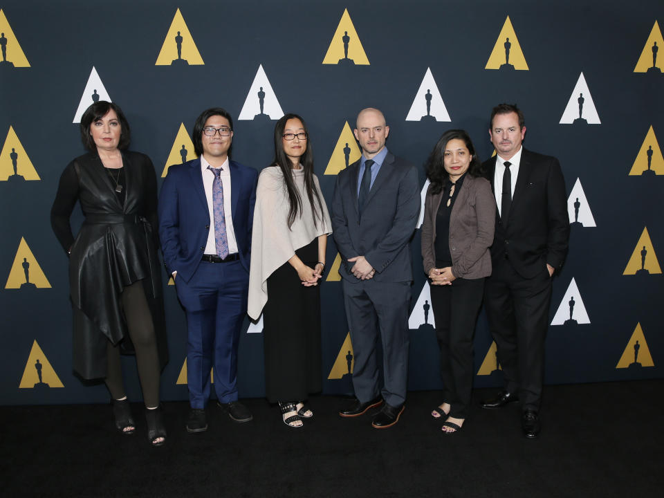 Jennifer Yuh Nelson, Academy Short Films and Feature Animation Branch Governor and Nicholl Fellowships in Screenwriting Committee Chair, third from left, poses with Nicholl fellows, from left to right, Karen McDermott, Aaron Chung, Walker McKnight, Renee Pillai and Sean Malcolm at the Academy Nicholl Fellowships in Screenwriting Awards and Live Read at the Academy of Motion Picture Arts and Sciences Samuel Goldwyn Theater, Thursday, Nov. 7, 2019, in Beverly Hills, Calif. (Photo by Danny Moloshok/Invision/AP)