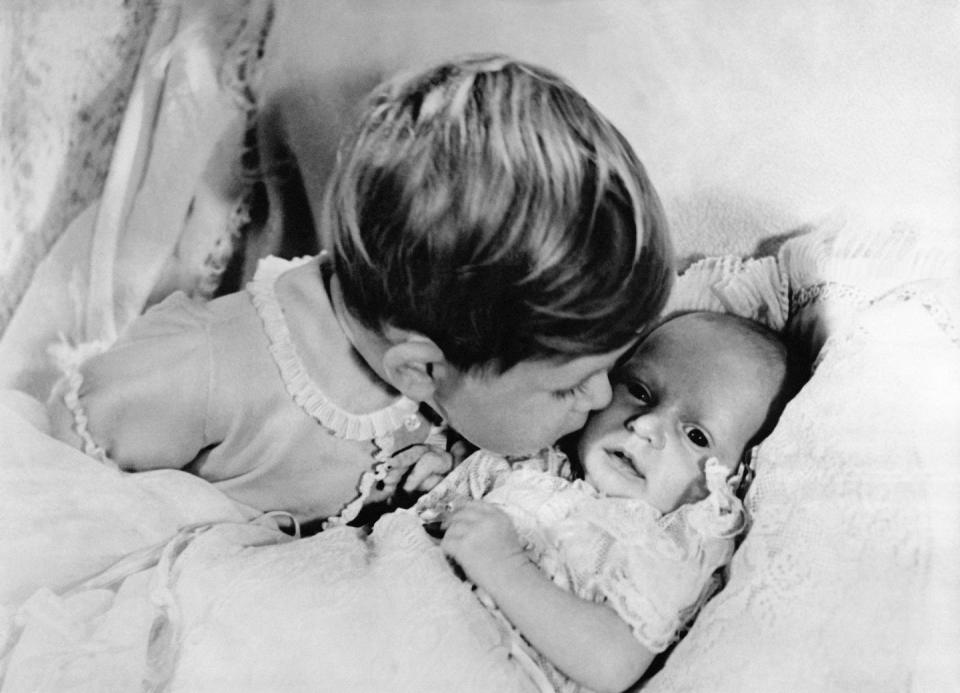 <p>Prince Charles, 2, gives his newborn sister, Princess Anne, a kiss on the cheek. Prince George and Princess Charlotte were photographed in <a href="https://www.harpersbazaar.com/celebrity/latest/a20197532/prince-louis-first-official-photo-compared-to-princess-charlotte/" rel="nofollow noopener" target="_blank" data-ylk="slk:similar poses;elm:context_link;itc:0" class="link ">similar poses</a> for their first photos with their siblings. </p>