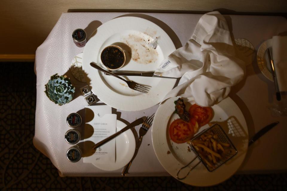 Plates on a table after lunch.