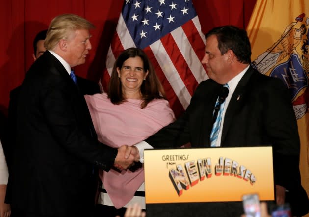 Governor Chris Christie welcomes Donald Trump to the stage. Mary Pat Christie, the governor’s wife, is at center. (Mike Segar / Reuters)