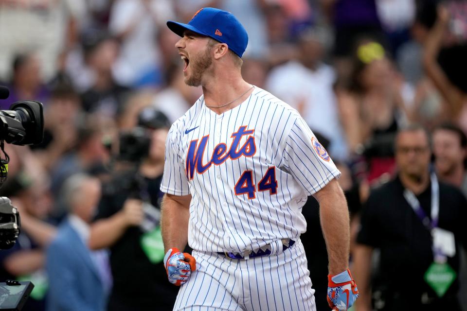 National League's Pete Alonso, of the New York Mets, cheers during the first round of the MLB All Star baseball Home Run Derby, Monday, July 12, 2021, in Denver.