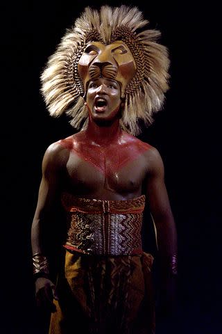 <p>Kirk McKoy/Los Angeles Times via Getty </p> Clifton Oliver in the theatrical production of 'The Lion King.'