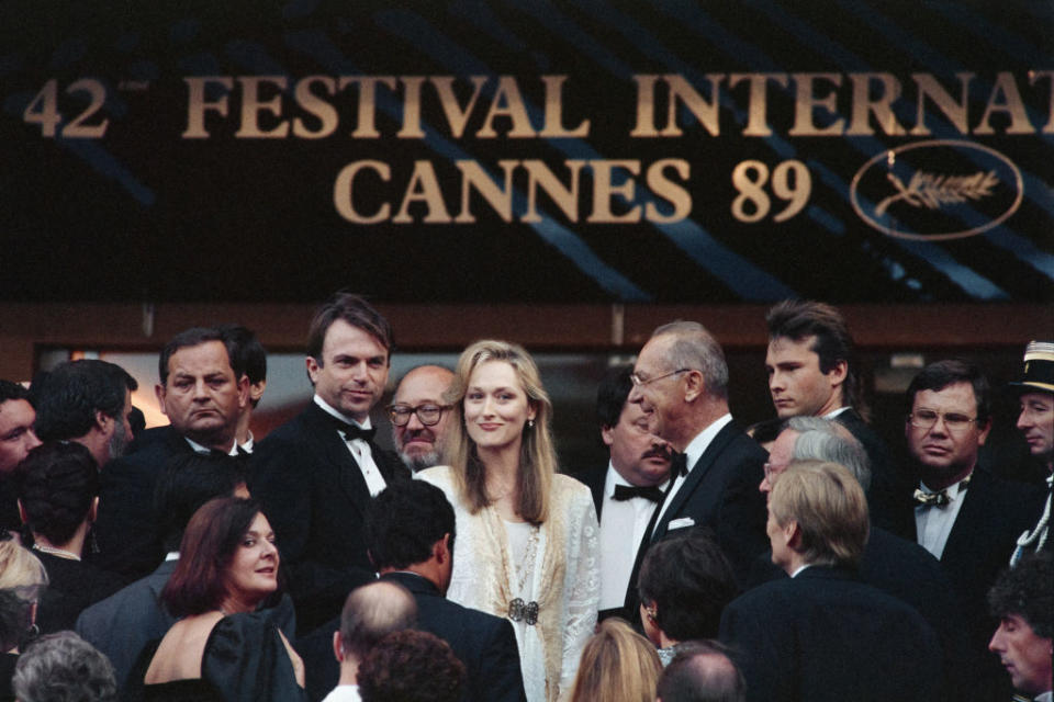 Meryl Streep (C), British actor Sam Neill (3rd L) and President of the Cannes Festival Pierre Viot (4th R) arrive on May 13, 1989 for the screening of the film 