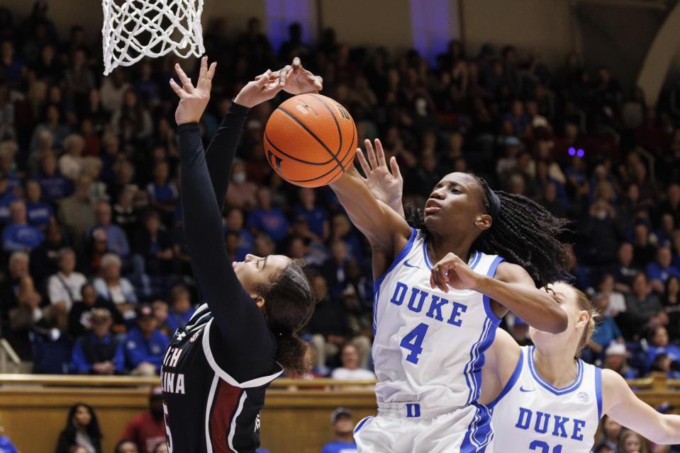 Duke's Jadyn Donovan (4) blocks the shot of South Carolina's Tessa Johnson (5) during the first half of an NCAA college basketball game in Durham, N.C., Sunday, Dec. 3, 2023. (AP Photo/Ben McKeown)