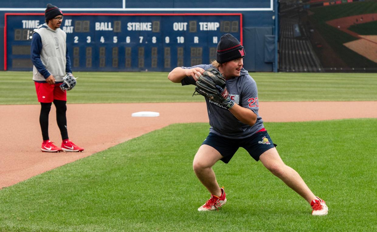 David Hamilton, left, and Chase Meidroth field ground balls on the first day of WooSox practice at Polar Park Tuesday.