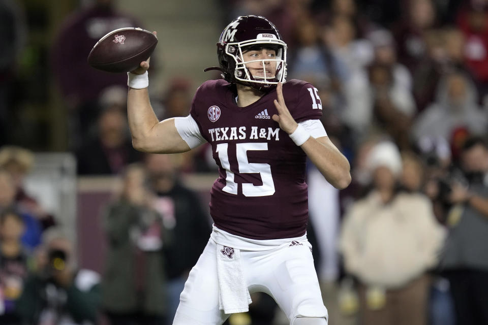 Texas A&M quarterback Conner Weigman (15) looks for a receiver during the first quarter of the team's NCAA college football game against LSU on Saturday, Nov. 26, 2022, in College Station, Texas. (AP Photo/Sam Craft)