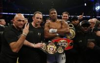 Britain Boxing - Anthony Joshua v Wladimir Klitschko IBF, IBO & WBA Super World Heavyweight Title's - Wembley Stadium, London, England - 29/4/17 Anthony Joshua celebrates with trainer Robert McCracken, promoter Eddie Hearn and his corner after winning the fight Action Images via Reuters / Andrew Couldridge