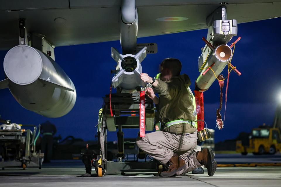 In this handout image provided by the UK Ministry of Defense, Royal Air Force weapon technicians prepare a RAF Typhoon FRG4 aircraft for strikes against Houthi military targets in Yemen on Feb. 3, 2024.