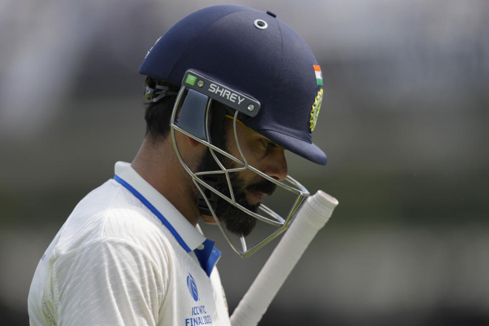 India's Virat Kohli walks off the pitch after being given out caught by Australia's Steven Smith off the bowling of Australia's Scott Boland on the fifth day of the ICC World Test Championship Final between India and Australia at The Oval cricket ground in London, Sunday, June 11, 2023. (AP Photo/Kirsty Wigglesworth)