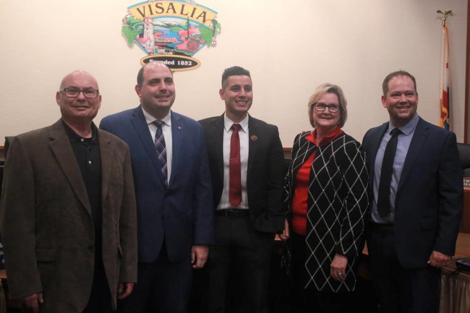 Visalia’s newly elected city council member Emmanuel Hernández Soto (center) with the rest of the city council after taking oath Wednesday night (Dec. 7) during a special meeting.