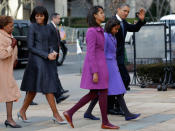 Not to be outdone by their stylish mother, Sasha and Malia Obama take a stylish turn in warm-looking coats. Malia wears a magenta J. Crew coat while Sasha wears a light purple Kate Spade coat. The budding fashionistas also wear matching tights and complementing flats. Maybe Malia has a future in modeling? The cute teenager has grown so much she looks almost as tall as her parents! (AP Photo/Jacquelyn Martin)